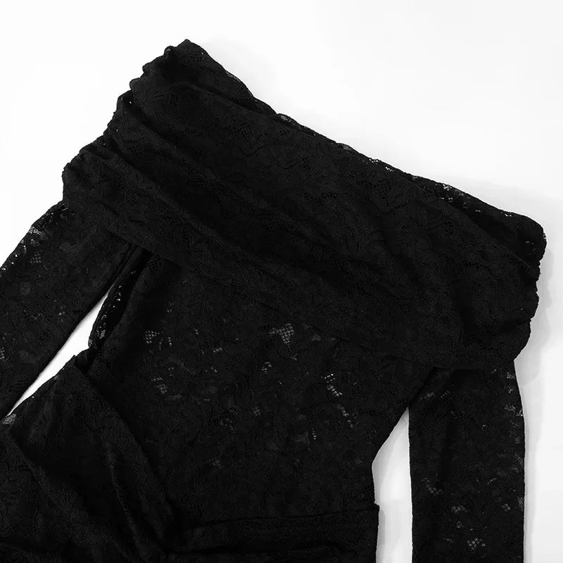 Woman wearing a figure flattering Andie Long Sleeve Lace jumpsuit - Classic Black BODYCON COLLECTION