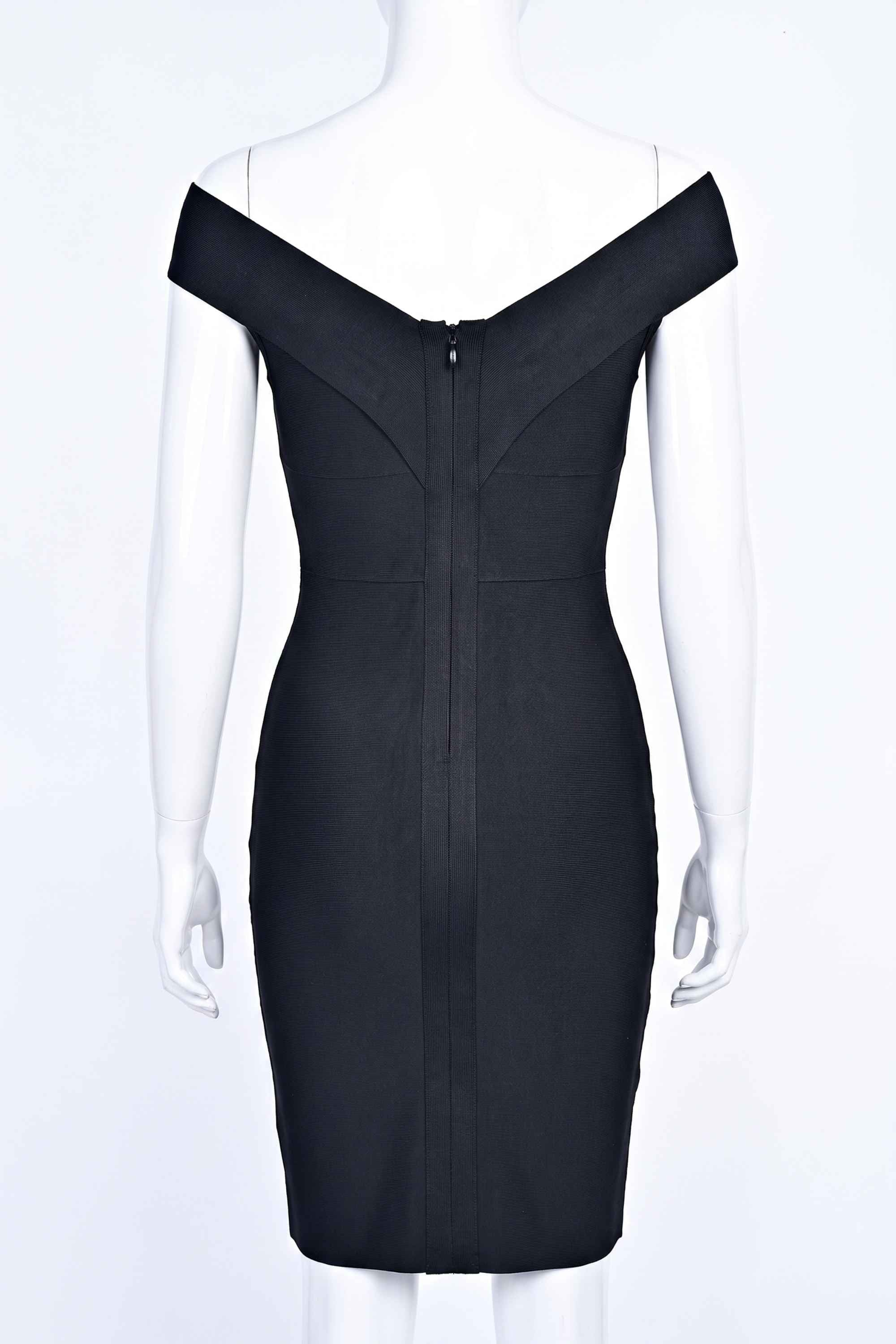 Woman wearing a figure flattering Ash Bandage Dress - Classic Black Bodycon Collection
