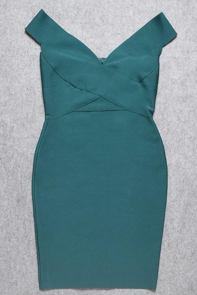 Woman wearing a figure flattering Ash Bandage Dress - Emerald Green Bodycon Collection