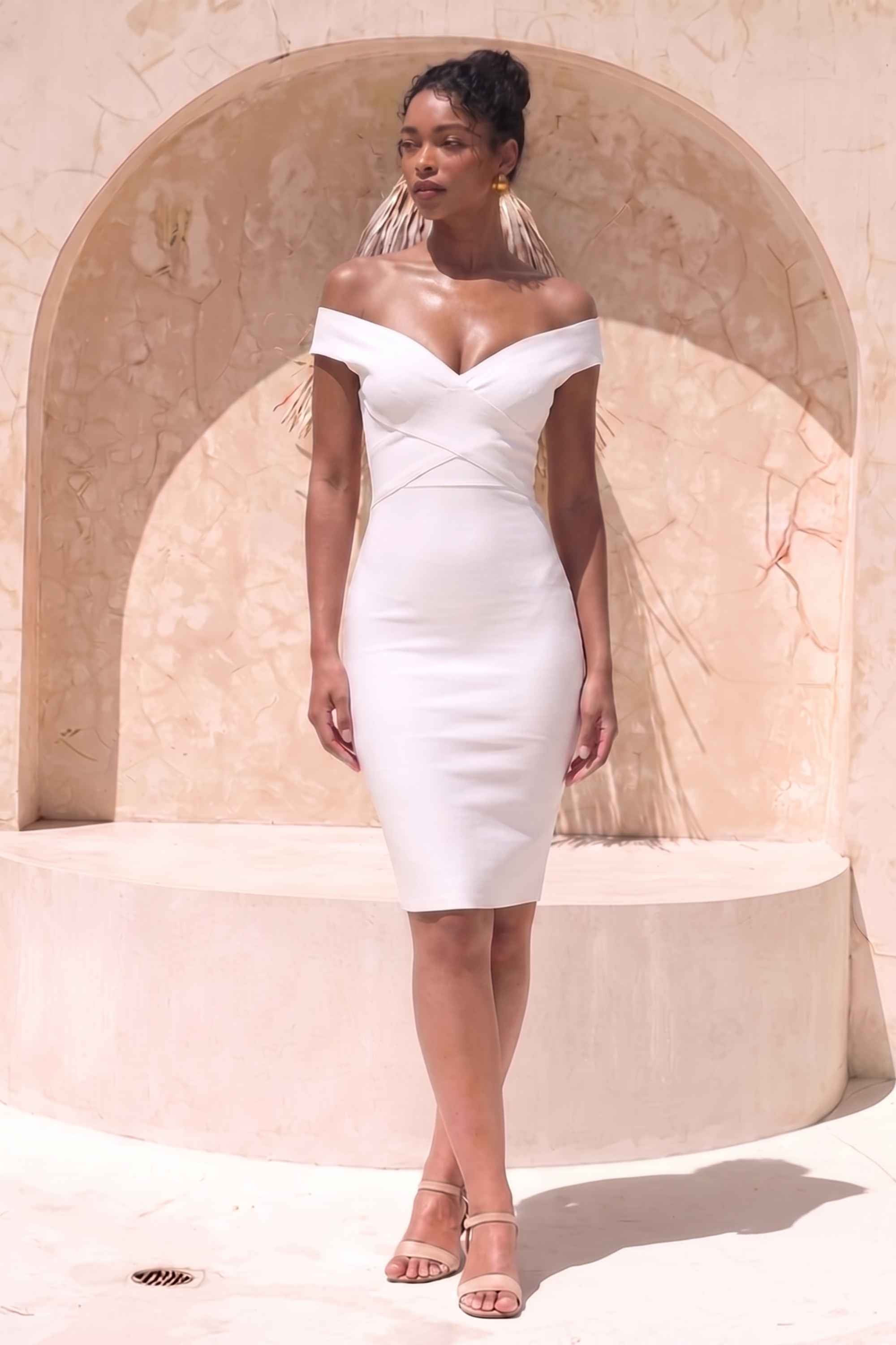 Woman wearing a figure flattering Ash Bandage Dress - White Pearl Bodycon Collection