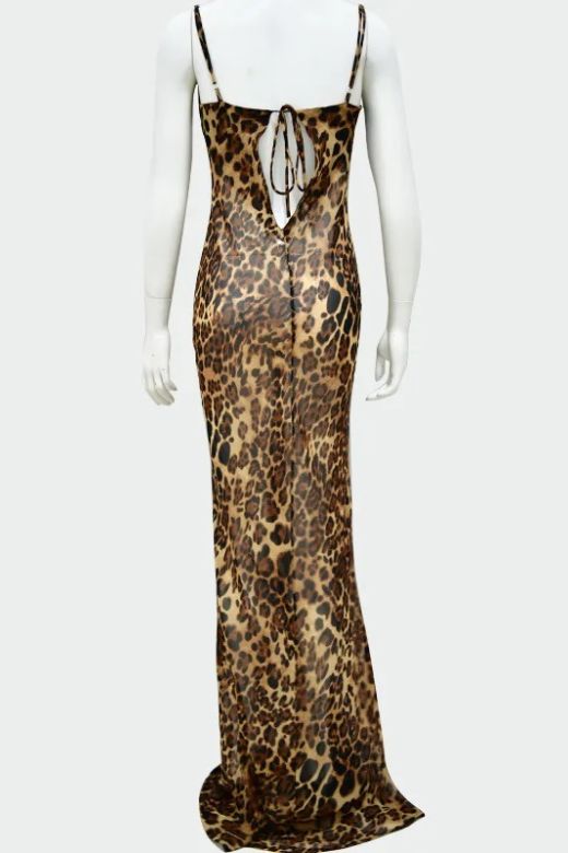 Woman wearing a figure flattering Athena Bodycon Maxi Dress - Leopard Print Yellow BODYCON COLLECTION