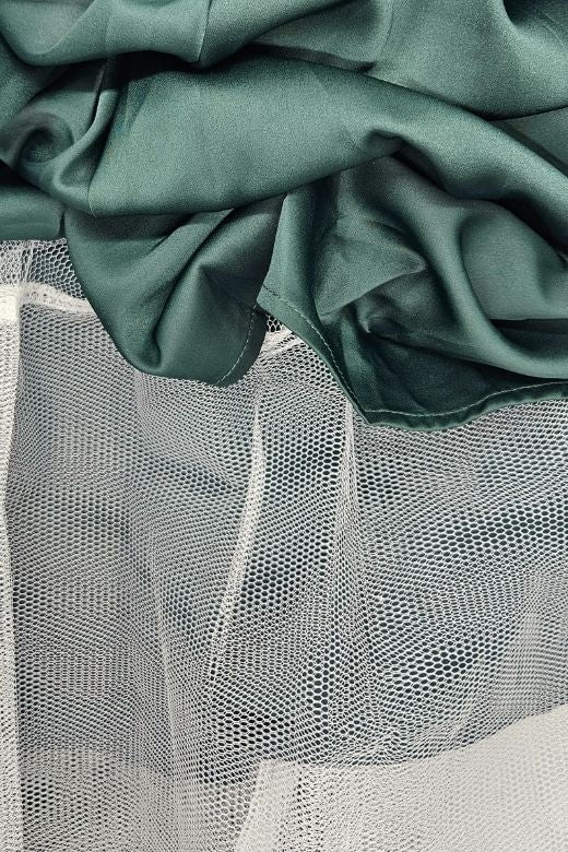 Woman wearing a figure flattering Mavis Midi Dress - Emerald Green (Sale) BODYCON COLLECTION