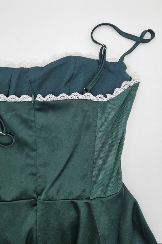 Woman wearing a figure flattering Mavis Midi Dress - Emerald Green (Sale) BODYCON COLLECTION