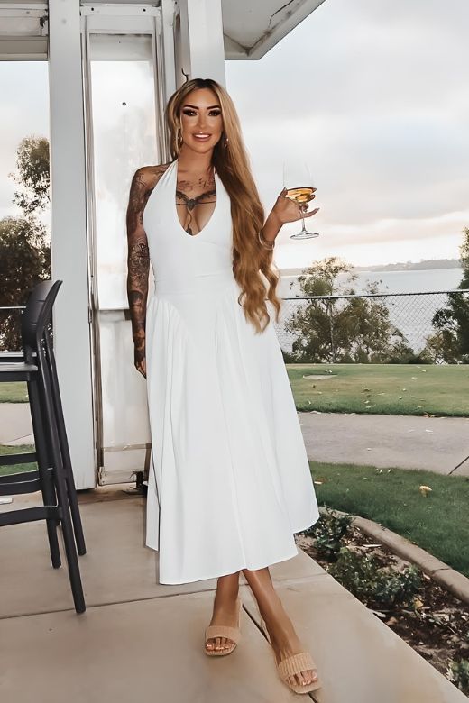 Woman wearing a figure flattering Austen Bodycon Midi Dress - Pearl White BODYCON COLLECTION