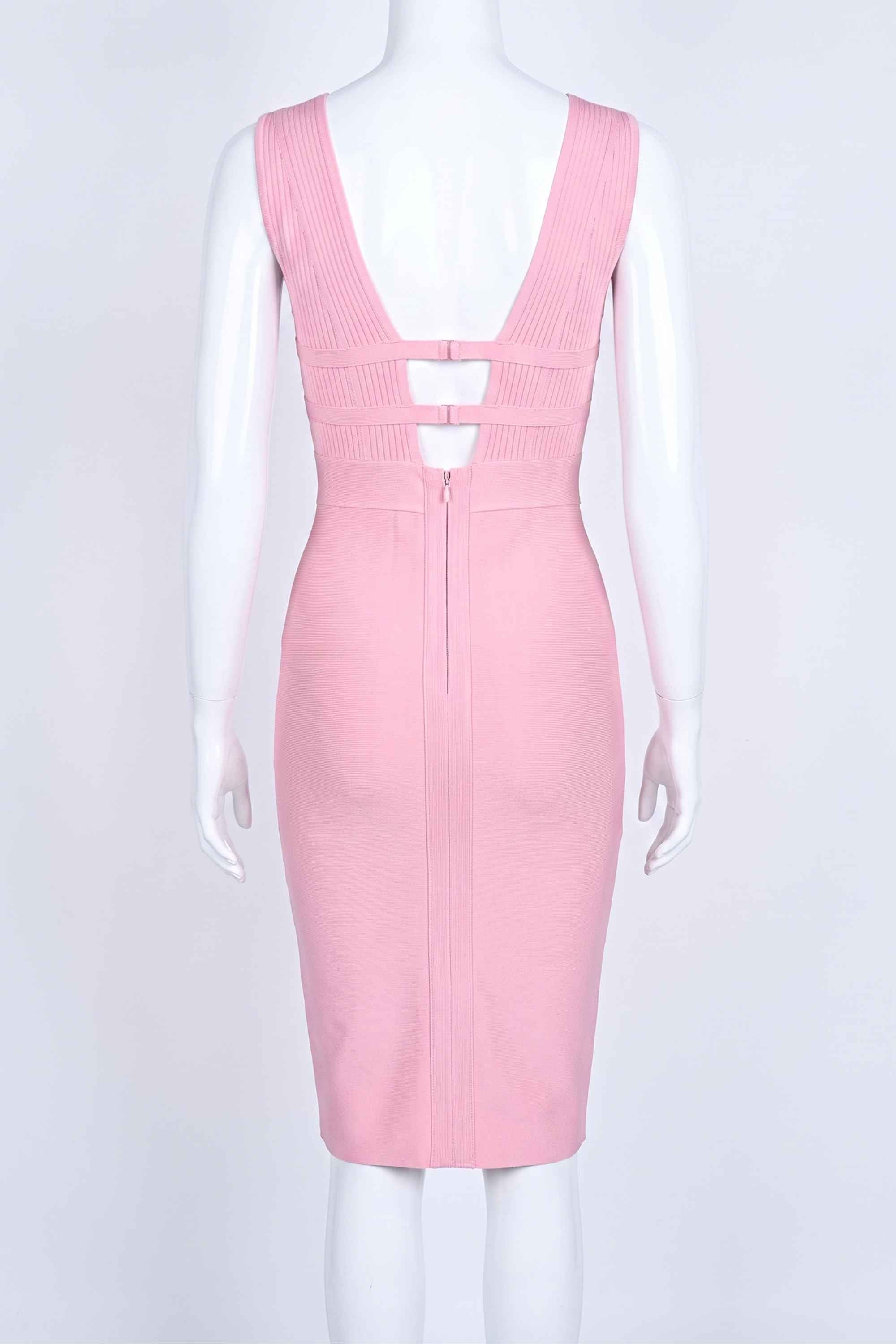 Woman wearing a figure flattering Bay Bandage Dress - Blush Pink Bodycon Collection
