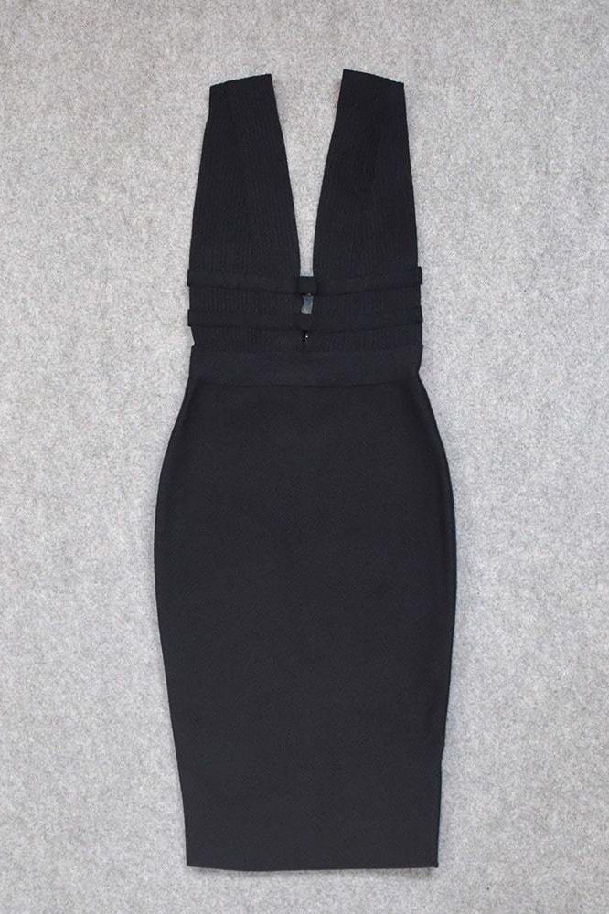 Woman wearing a figure flattering Bay Bandage Dress - Classic Black Bodycon Collection