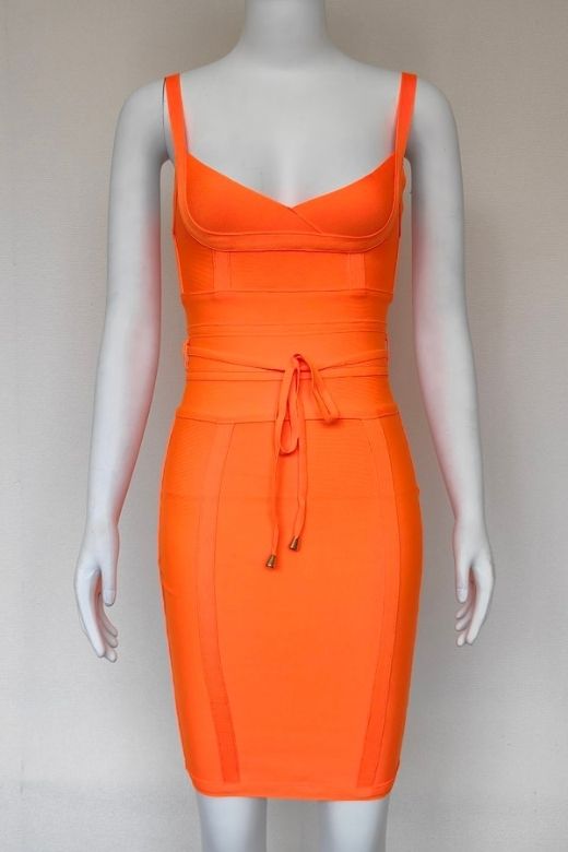 Woman wearing a figure flattering Bek Bandage Dress - Apricot Orange Bodycon Collection