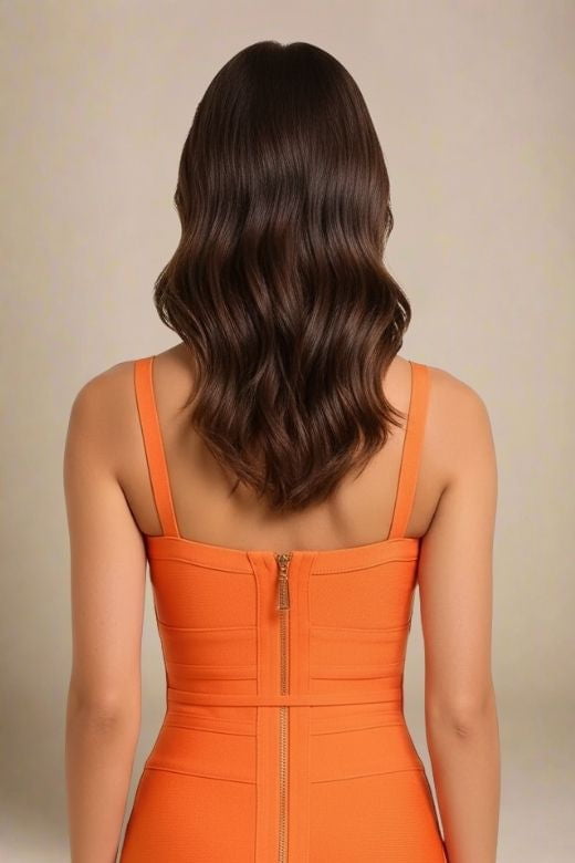 Woman wearing a figure flattering Bek Bandage Dress - Apricot Orange Bodycon Collection