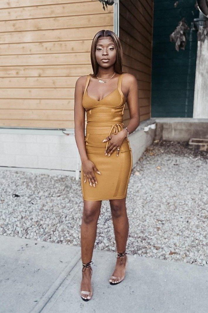 Woman wearing a figure flattering Bek Bandage Dress - Apricot Orange Bodycon Collection