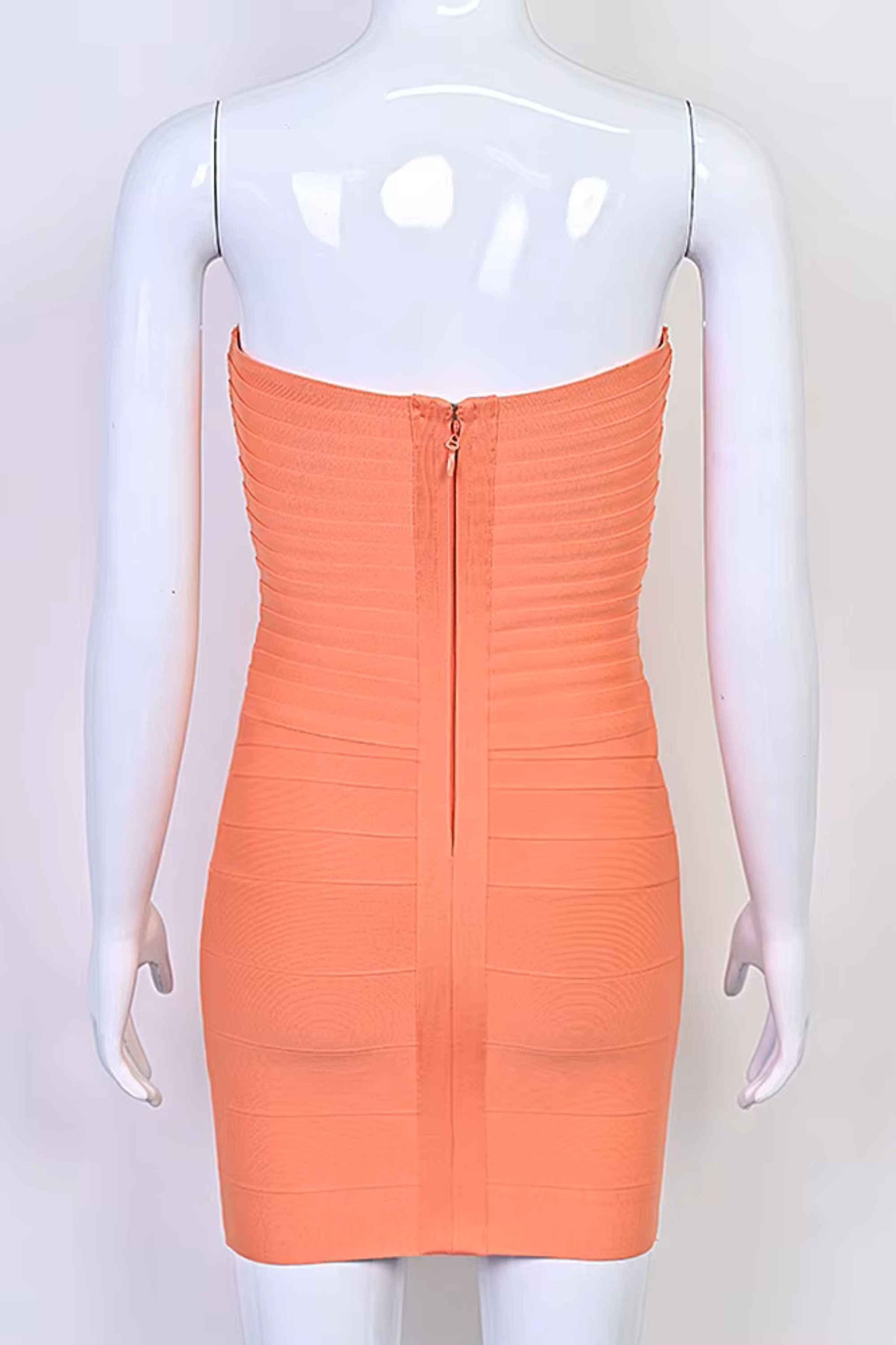 Woman wearing a figure flattering Belle Bandage Mini Dress - Coral BODYCON COLLECTION Pty Ltd