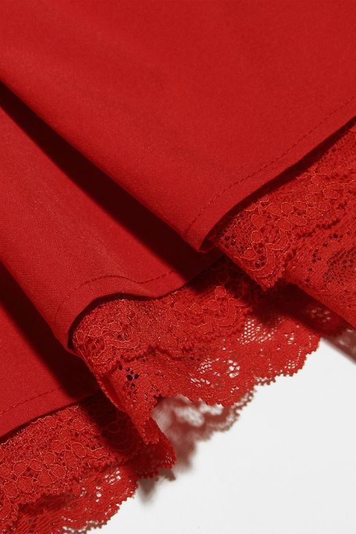 Woman wearing a figure flattering Belle Bodycon Mini Dress - Lipstick Red BODYCON COLLECTION