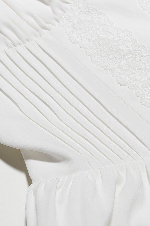 Woman wearing a figure flattering Belle Bodycon Mini Dress - Pearl White BODYCON COLLECTION