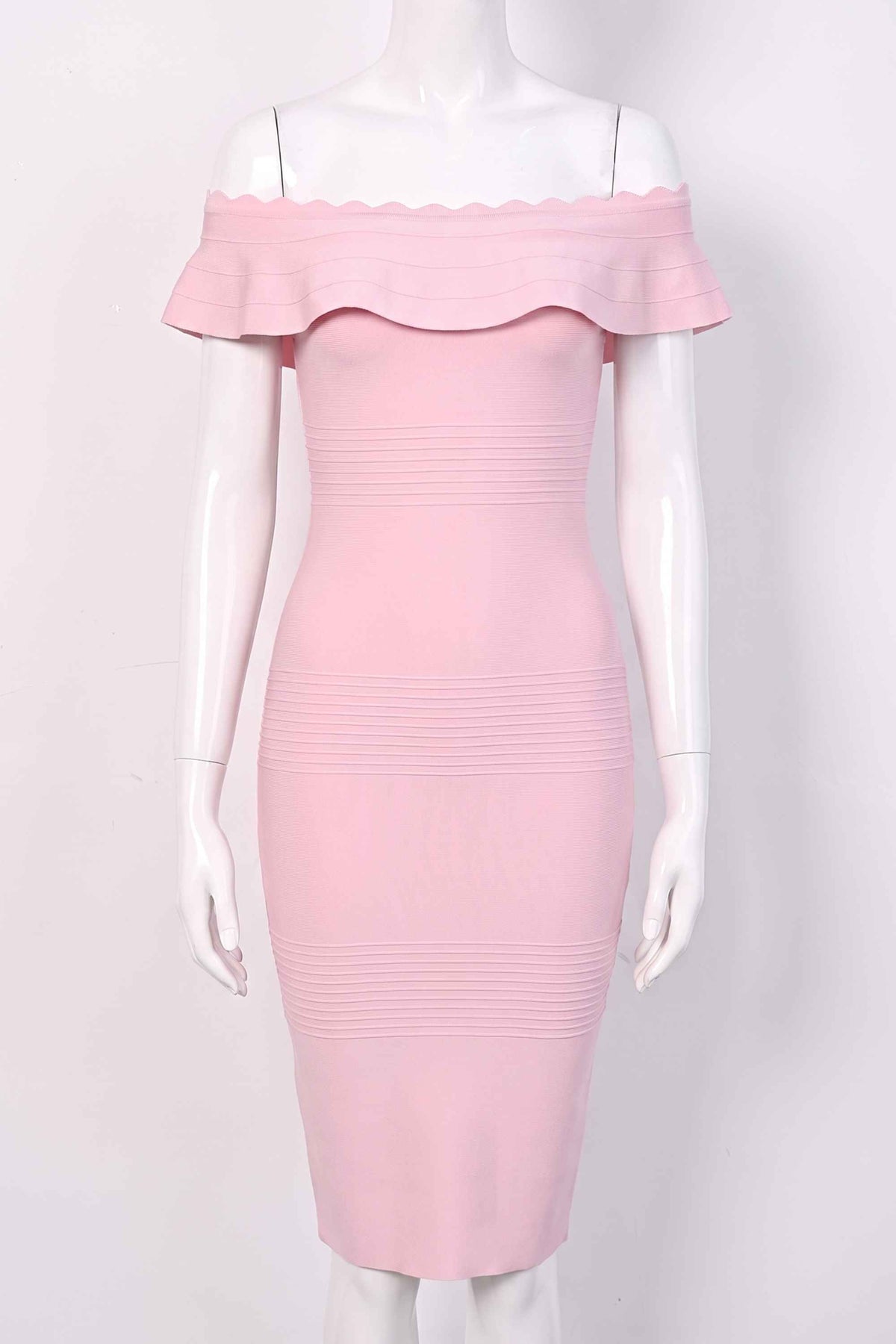 Woman wearing a figure flattering Billie Bandage Midi Dress - Dusty Pink Bodycon Collection