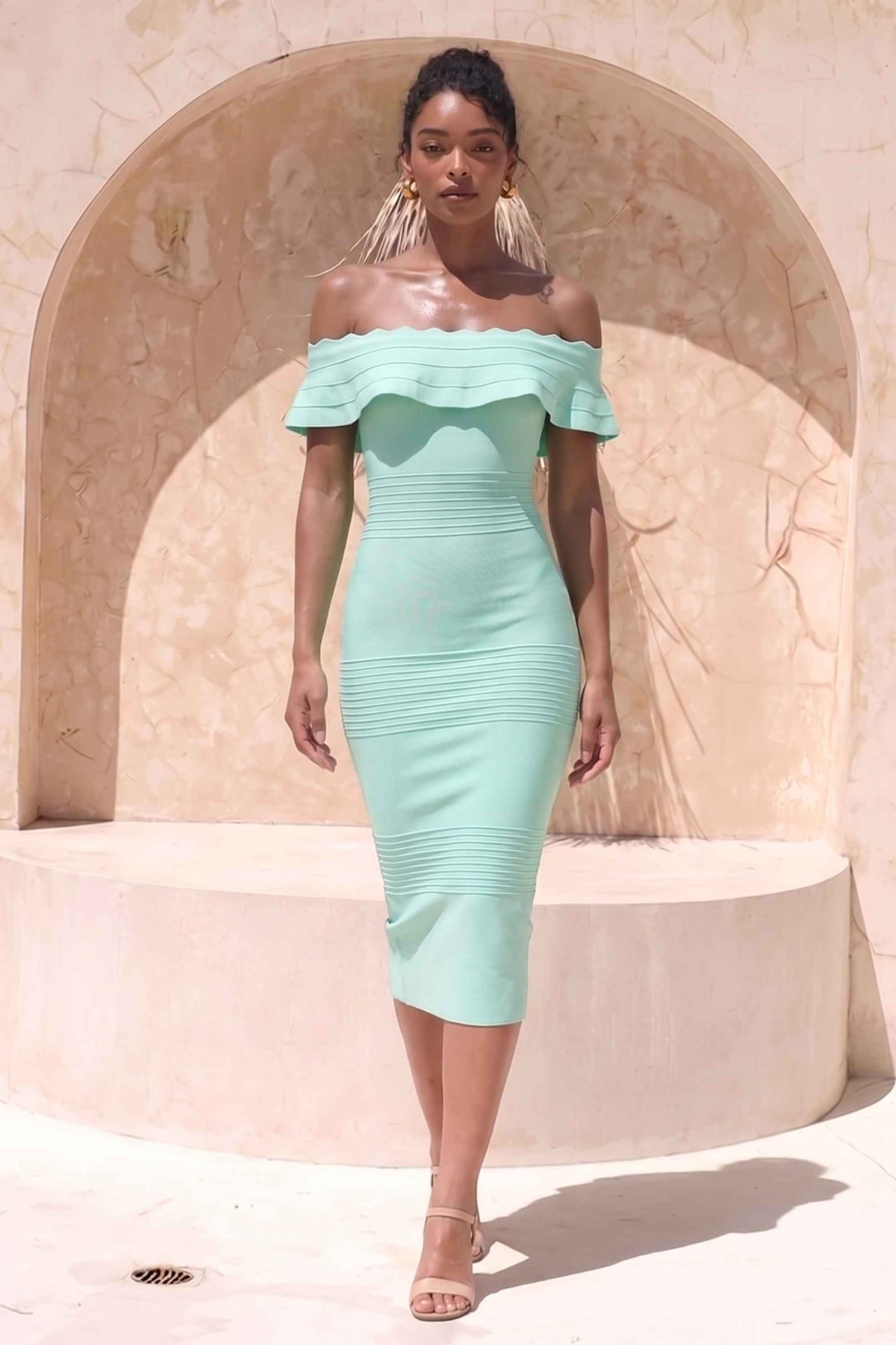 Woman wearing a figure flattering Billie Bandage Midi Dress - Mint Green Bodycon Collection