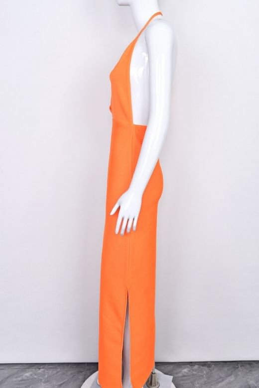 Woman wearing a figure flattering Blake Bandage Maxi Dress - Apricot Orange BODYCON COLLECTION