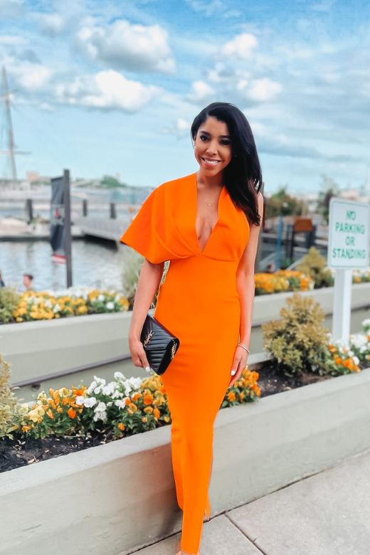 Woman wearing a figure flattering Blake Bandage Maxi Dress - Apricot Orange BODYCON COLLECTION