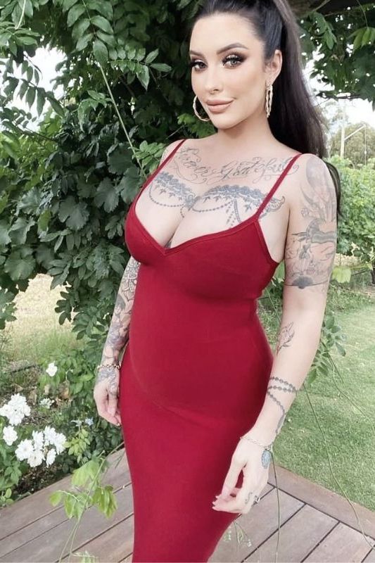 Woman wearing a figure flattering Blanche Bandage Midi Dress - Lipstick Red BODYCON COLLECTION