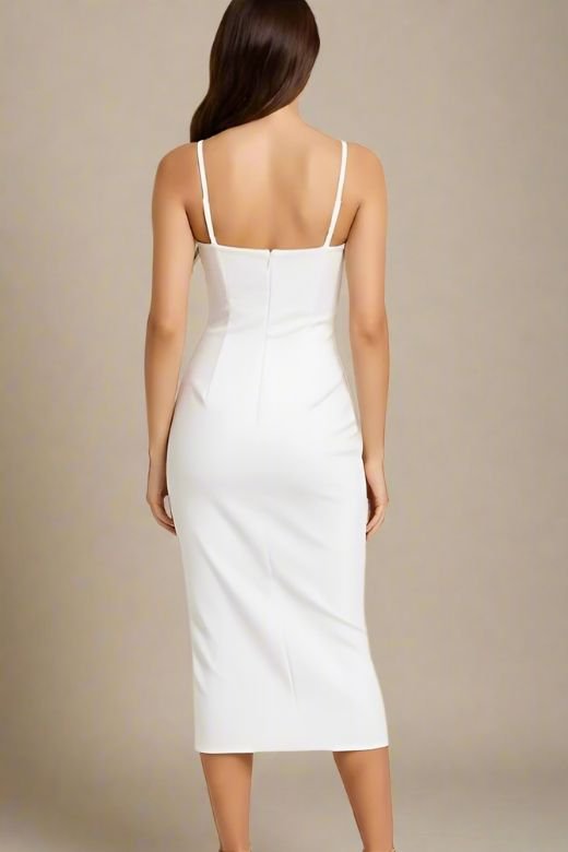 Woman wearing a figure flattering Blanche Bandage Midi Dress - White Pearl BODYCON COLLECTION
