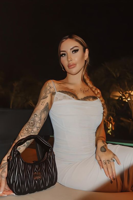 Woman wearing a figure flattering Brianna Bodycon Wrap Maxi Dress - Dusty Pink BODYCON COLLECTION