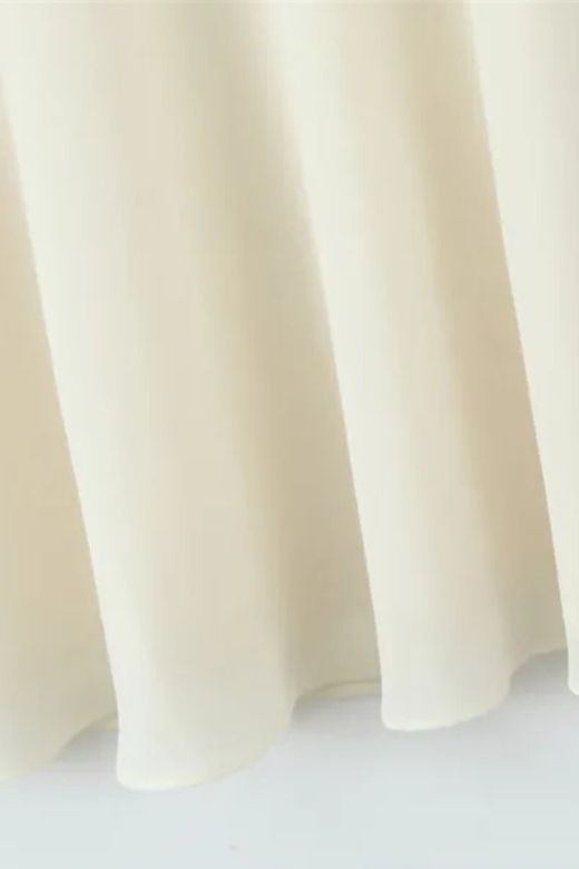 Woman wearing a figure flattering  Cali Wrap Top and Maxi Skirt Set - Ivory White BODYCON COLLECTION