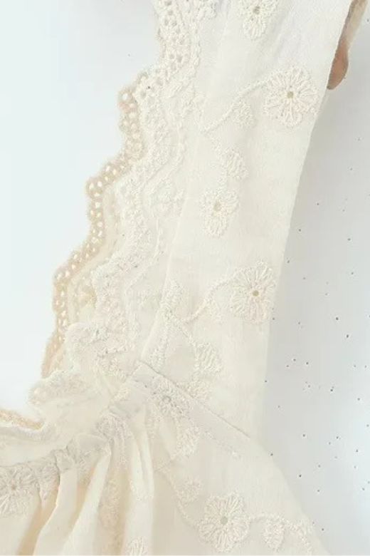 Woman wearing a figure flattering  Cali Wrap Top and Maxi Skirt Set - Ivory White BODYCON COLLECTION