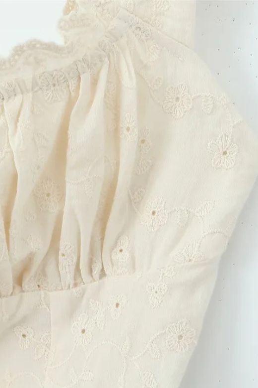 Woman wearing a figure flattering  Cali Wrap Top and Maxi Skirt Set - Ivory White BODYCON COLLECTION