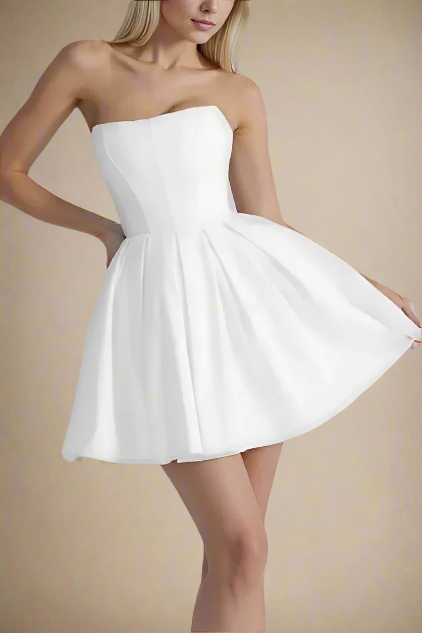 Woman wearing a figure flattering Capri Bodycon Strapless Mini Dress - Pearl White BODYCON COLLECTION