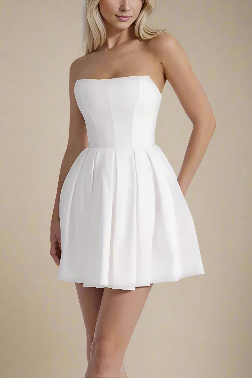 Woman wearing a figure flattering Capri Bodycon Strapless Mini Dress - Pearl White BODYCON COLLECTION