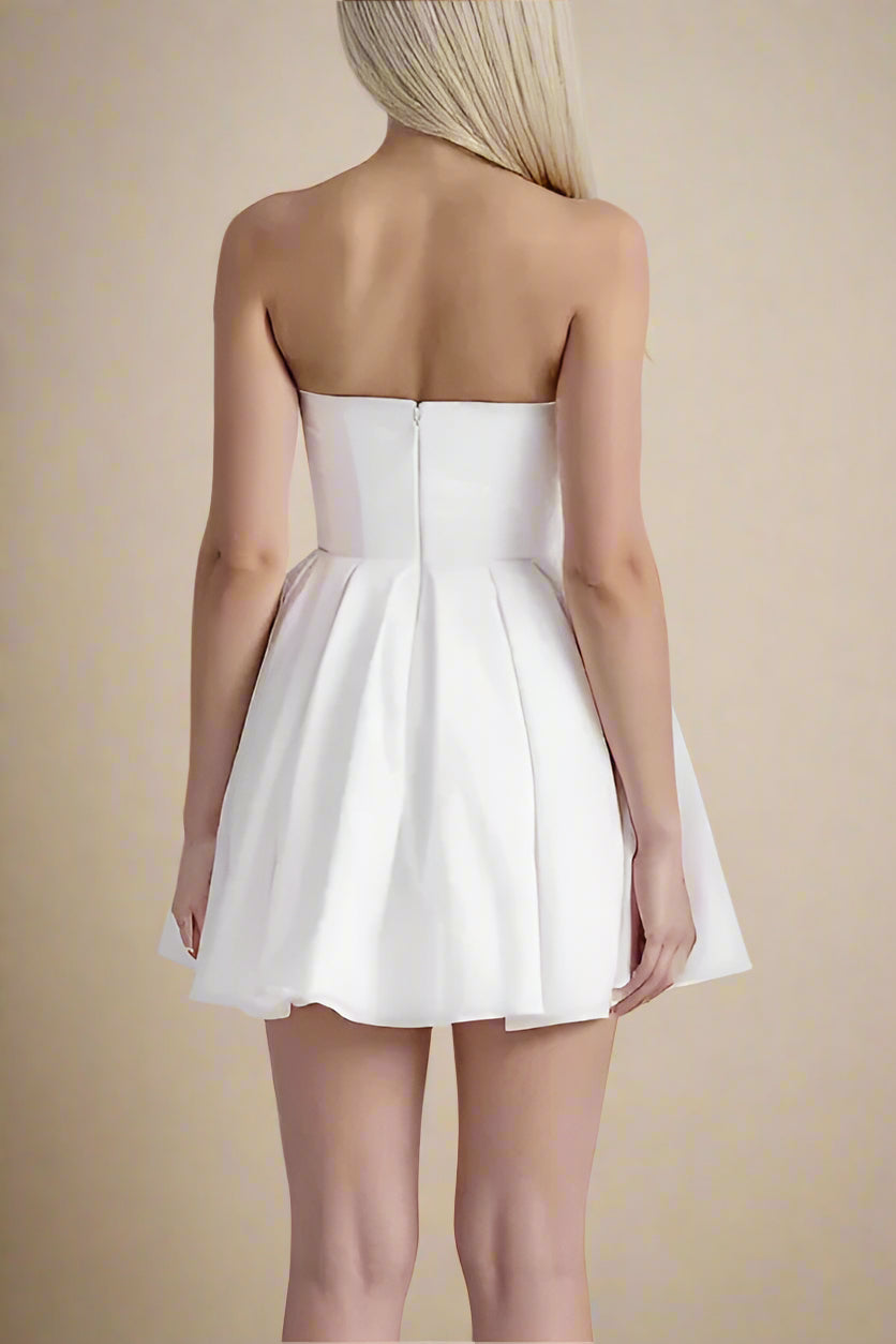 Woman wearing a figure flattering Capri Bodycon Strapless Mini Dress - Pearl White BODYCON COLLECTION