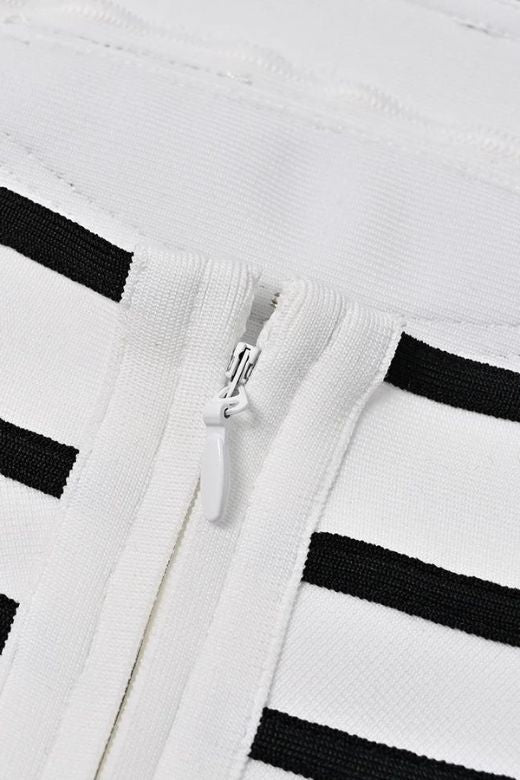 Woman wearing a figure flattering Carter Bandage Mini Dress - Pearl White BODYCON COLLECTION