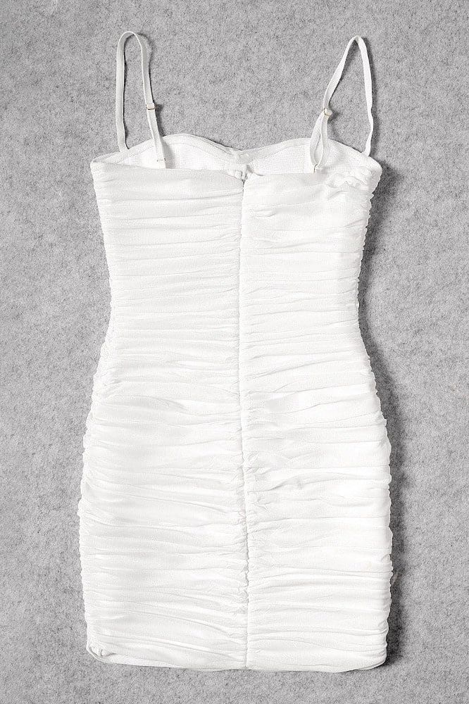 Woman wearing a figure flattering Cassie Bodycon Wrap Mini Dress - Pearl White BODYCON COLLECTION