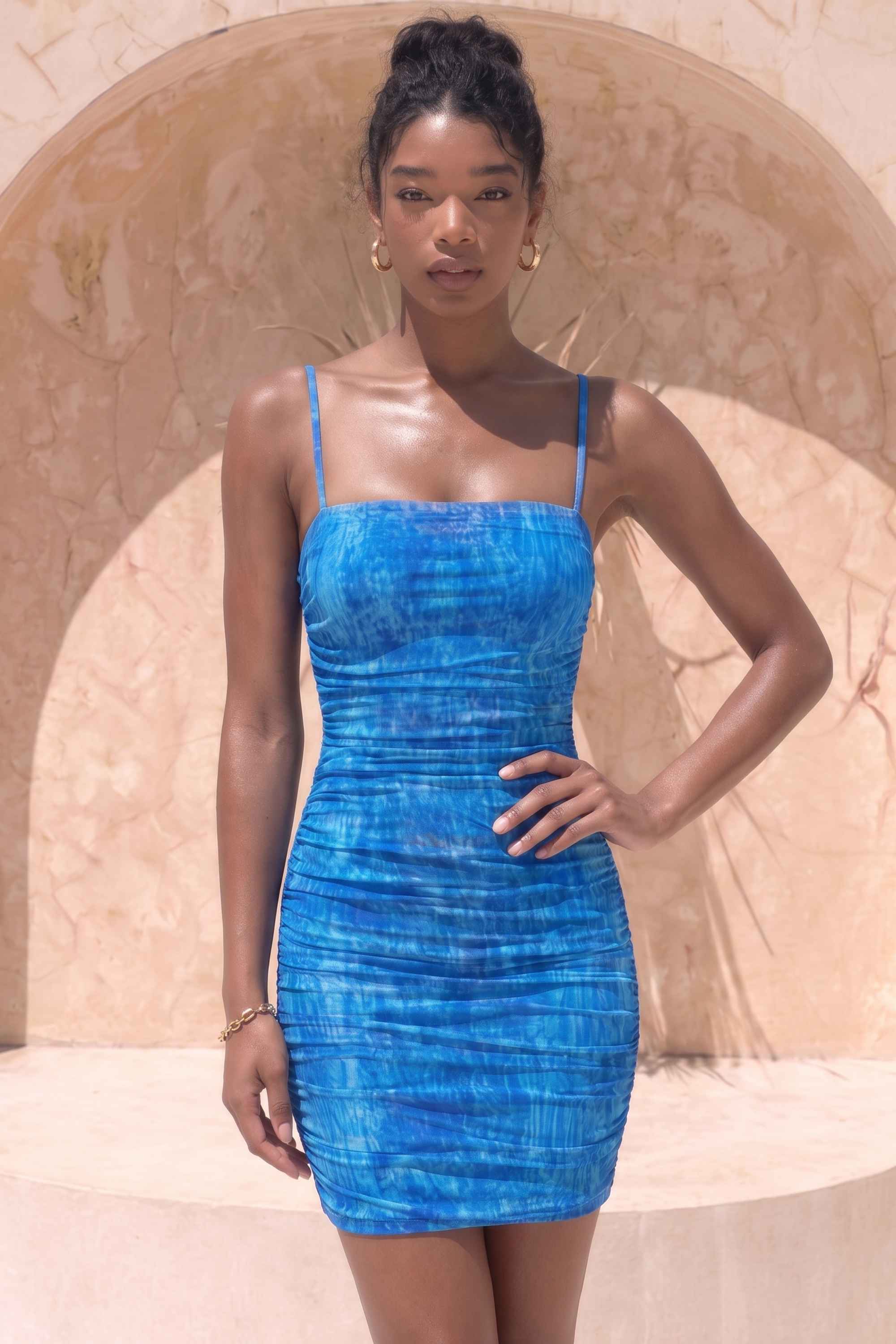 Woman wearing a figure flattering Cassie Bodycon Wrap Mini Dress - Royal Blue BODYCON COLLECTION