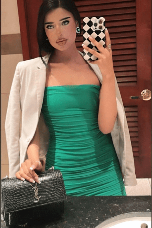 Woman wearing a figure flattering Cassie Bodycon Wrap Mini Dress - Violet Purple BODYCON COLLECTION