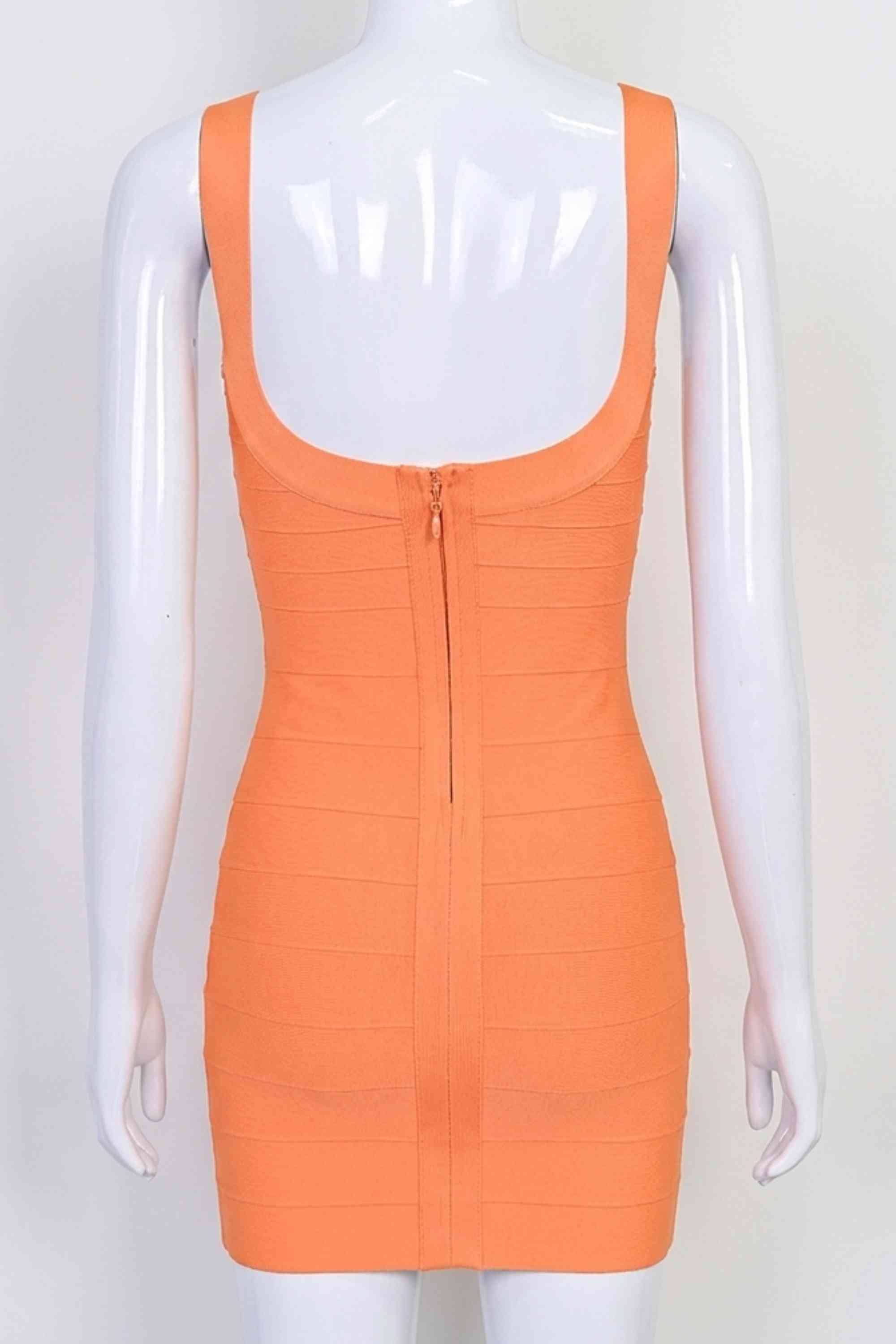 Woman wearing a figure flattering Cindy Bandage Mini Dress - Apricot Orange BODYCON COLLECTION Pty Ltd