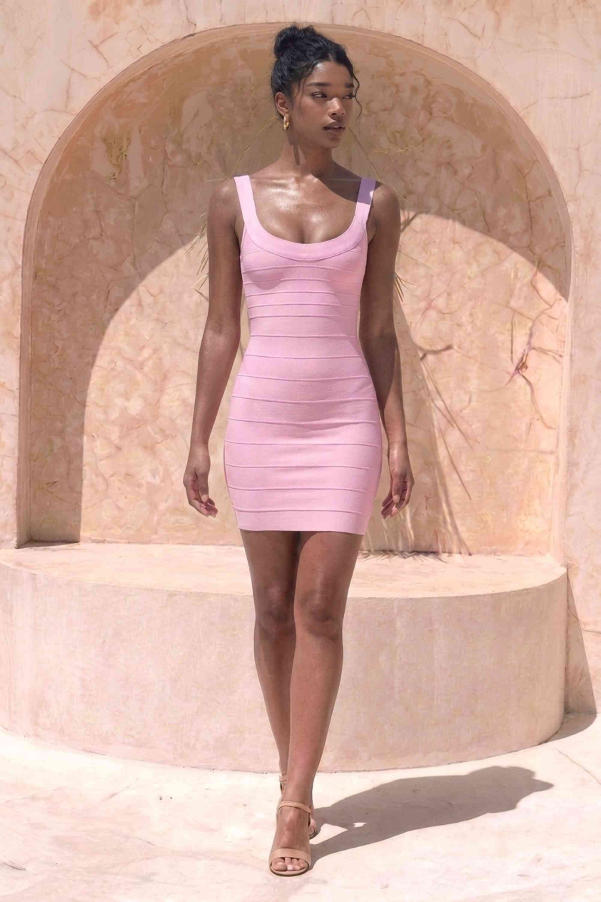 Woman wearing a figure flattering Cindy Bandage Mini Dress - Dusty Pink BODYCON COLLECTION Pty Ltd