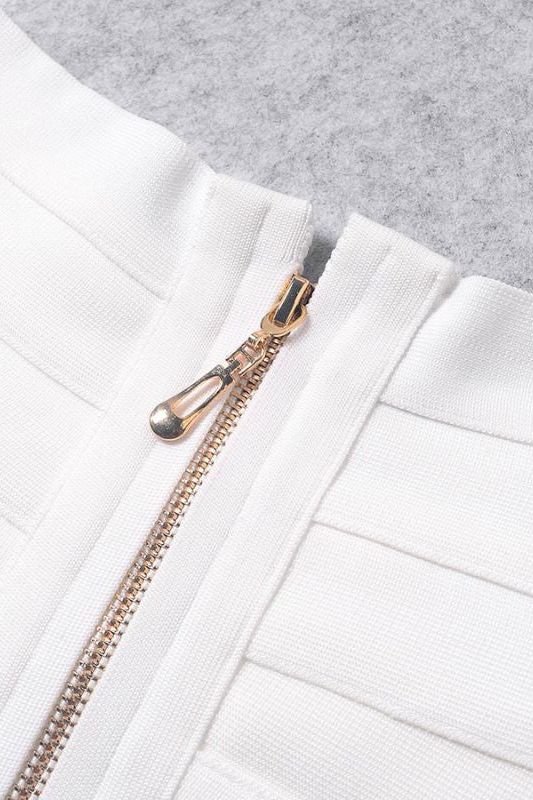 Woman wearing a figure flattering Cindy Bandage Off Shoulder Crop Top - Pearl White BODYCON COLLECTION