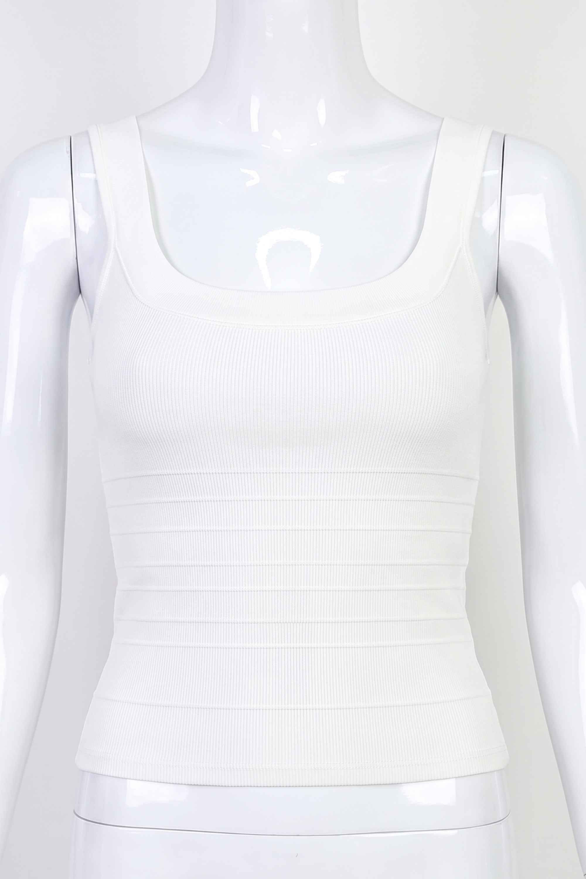 Woman wearing a figure flattering Cindy Bandage Top - Pearl White BODYCON COLLECTION Pty Ltd
