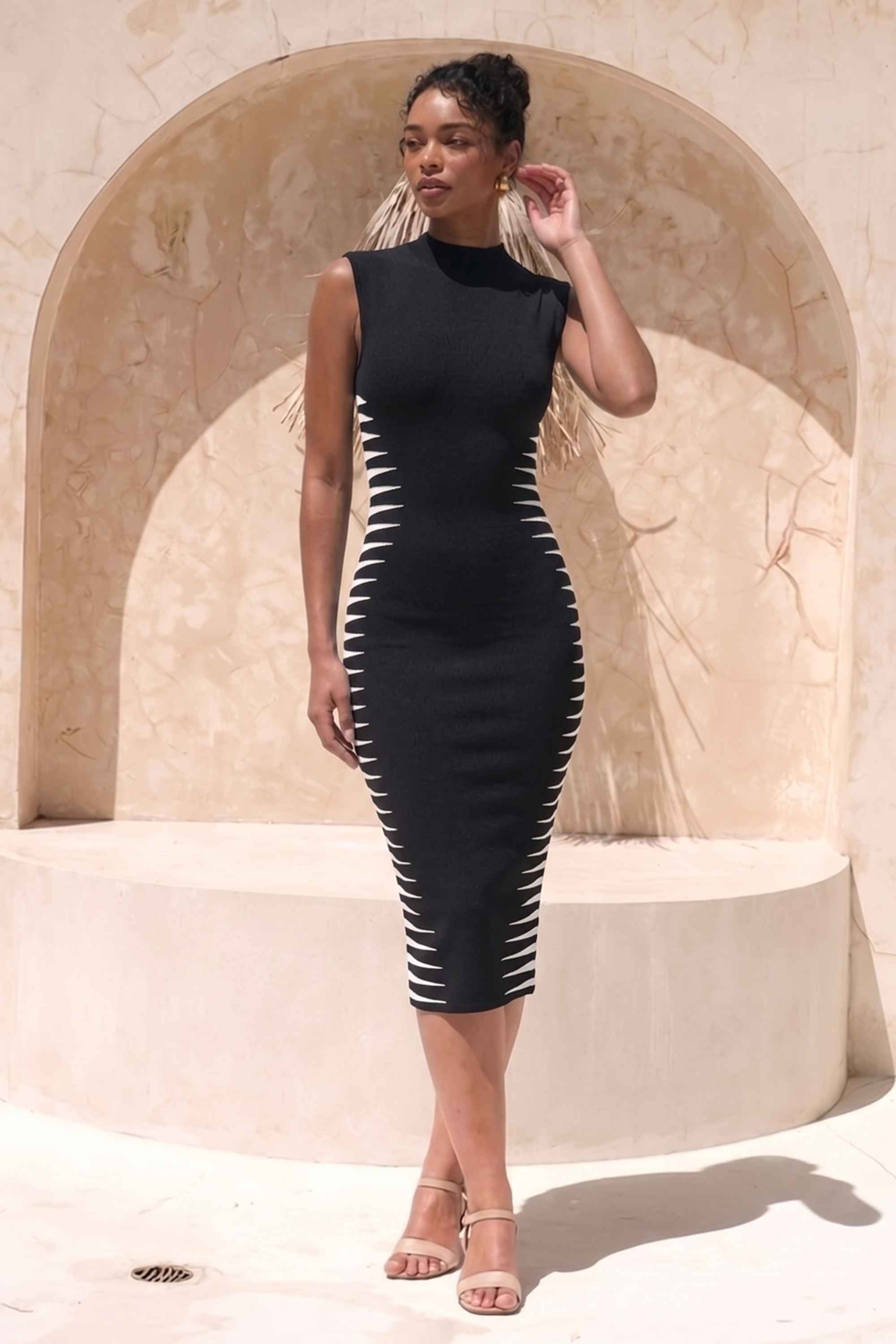 Woman wearing a figure flattering Cleo Bandage Midi Dress - Classic Black BODYCON COLLECTION Pty Ltd