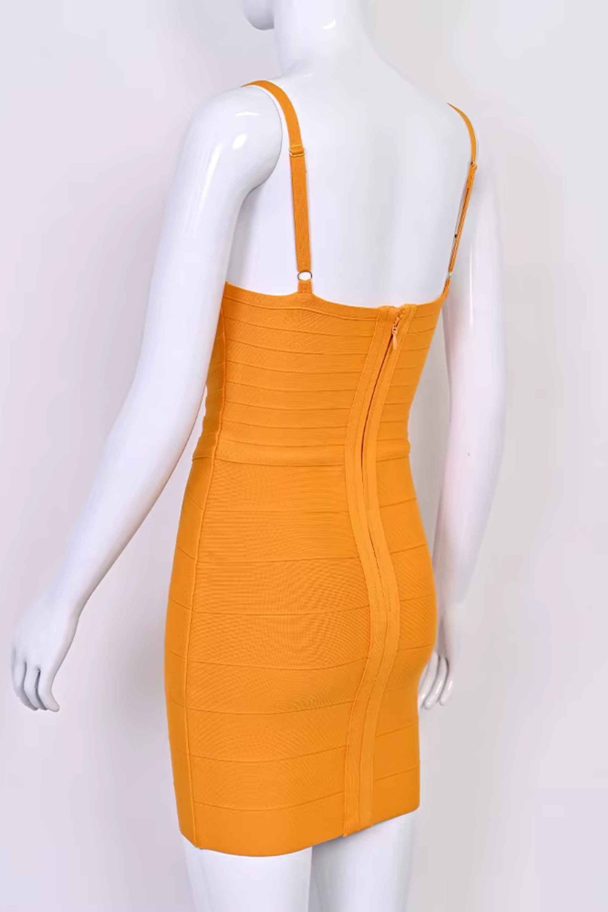 Woman wearing a figure flattering Dom Bandage Mini Dress - Apricot Orange BODYCON COLLECTION Pty Ltd