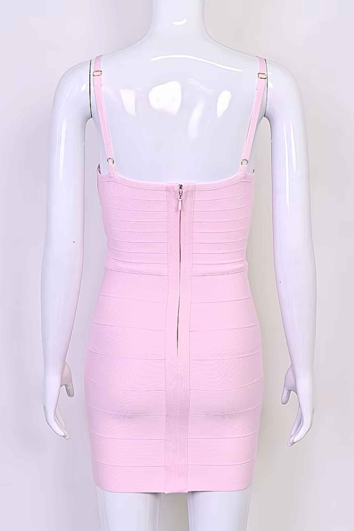 Woman wearing a figure flattering Dom Bandage Mini Dress - Dusty Pink BODYCON COLLECTION Pty Ltd