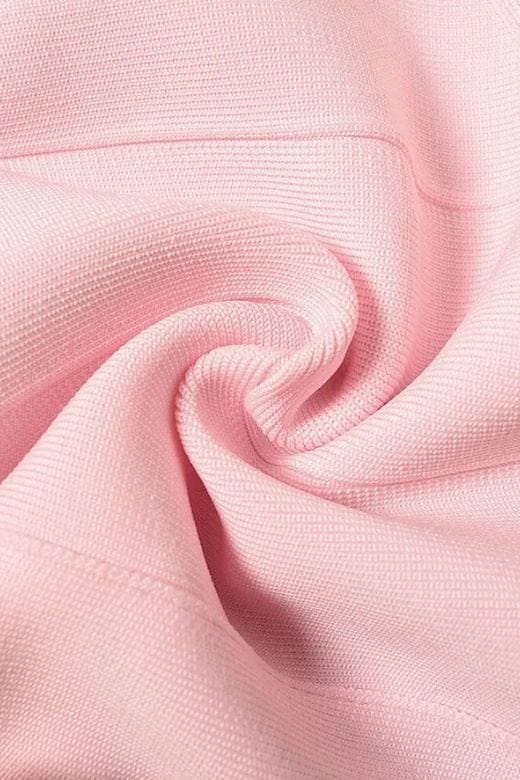 Woman wearing a figure flattering Elli Bandage Crop Top - Dusty Pink BODYCON COLLECTION