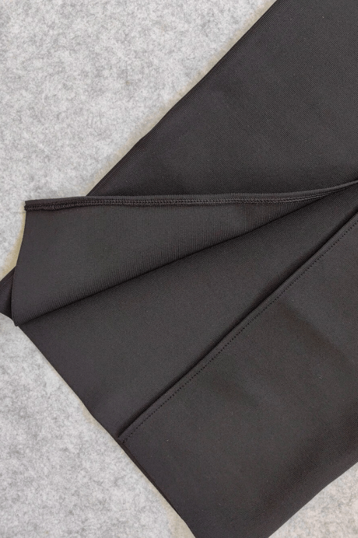 Woman wearing a figure flattering Erin Bodycon Maxi Dress - Classic Black BODYCON COLLECTION