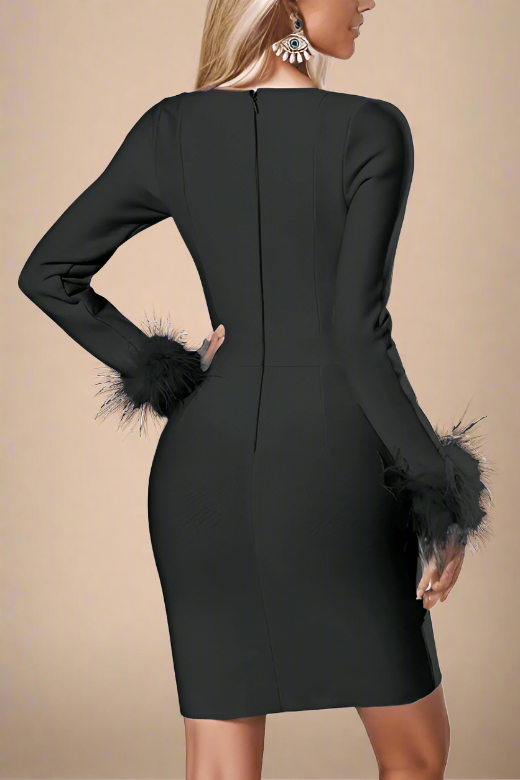 Woman wearing a figure flattering  Erin Long Sleeve Mini Dress - Classic Black BODYCON COLLECTION