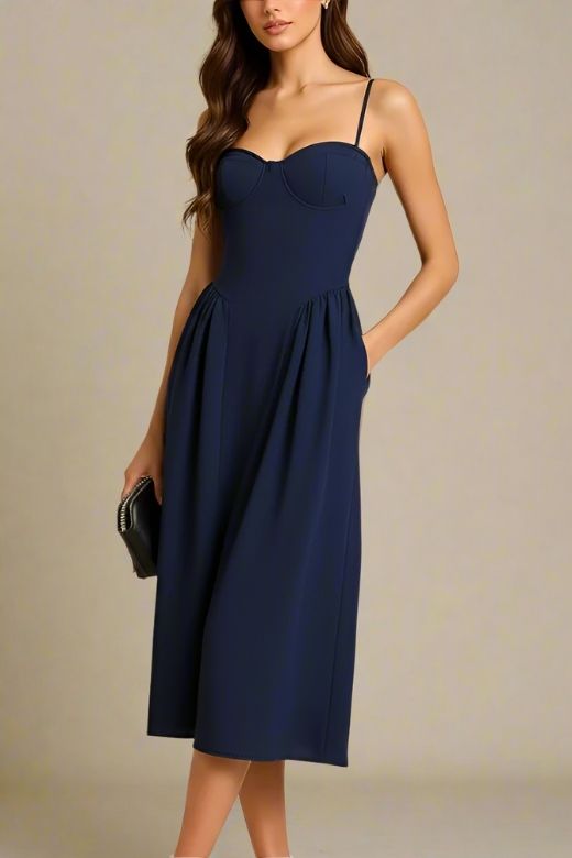 Woman wearing a figure flattering Everly Midi Dress - Navy Blue BODYCON COLLECTION