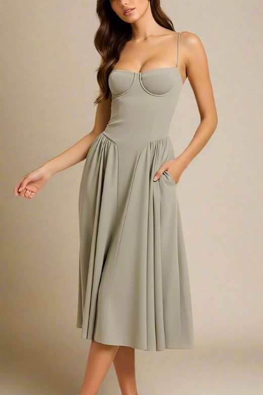 Woman wearing a figure flattering Everly Midi Dress - Sage Green BODYCON COLLECTION