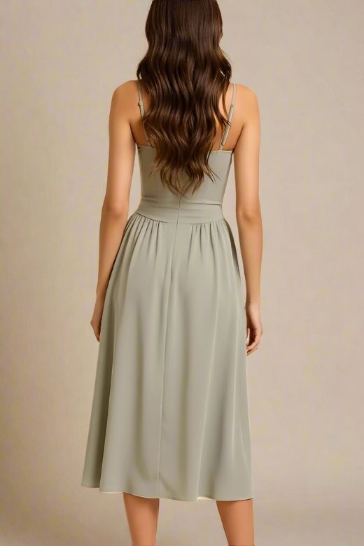 Woman wearing a figure flattering Everly Midi Dress - Sage Green BODYCON COLLECTION