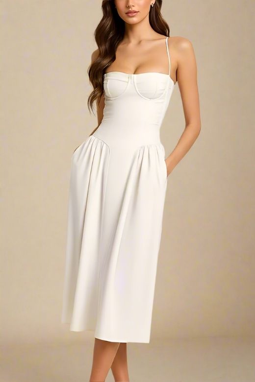 Woman wearing a figure flattering Everly Midi Dress - White Pearl BODYCON COLLECTION