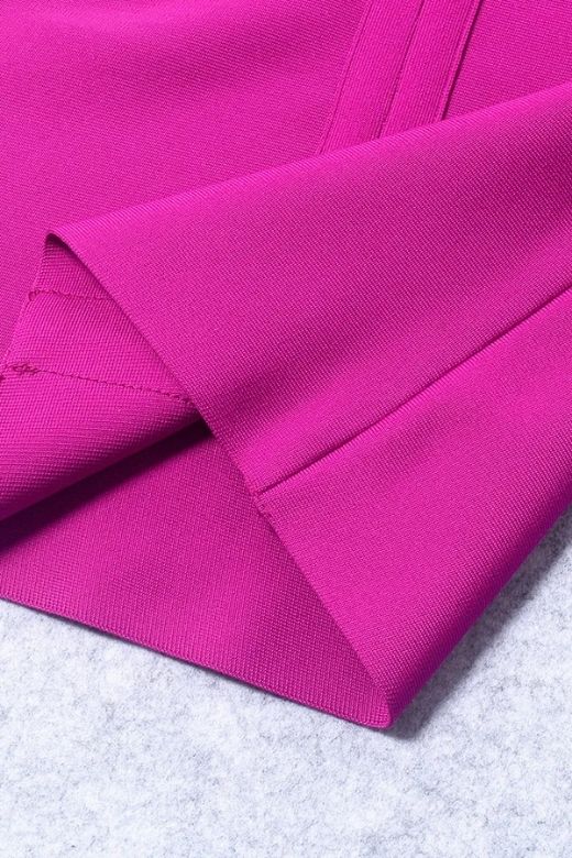 Woman wearing a figure flattering Freya Bandage Dress - Magenta Pink BODYCON COLLECTION