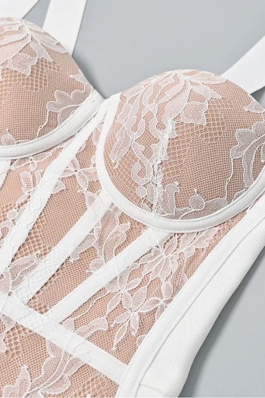 Woman wearing a figure flattering Genevieve Bodycon Lace Midi Dress - Pearl White BODYCON COLLECTION