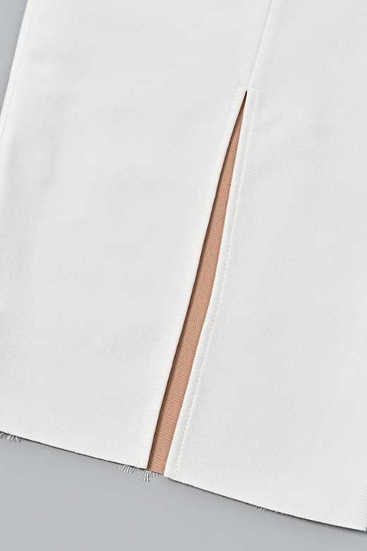 Woman wearing a figure flattering Genevieve Bodycon Lace Midi Dress - White Pearl BODYCON COLLECTION